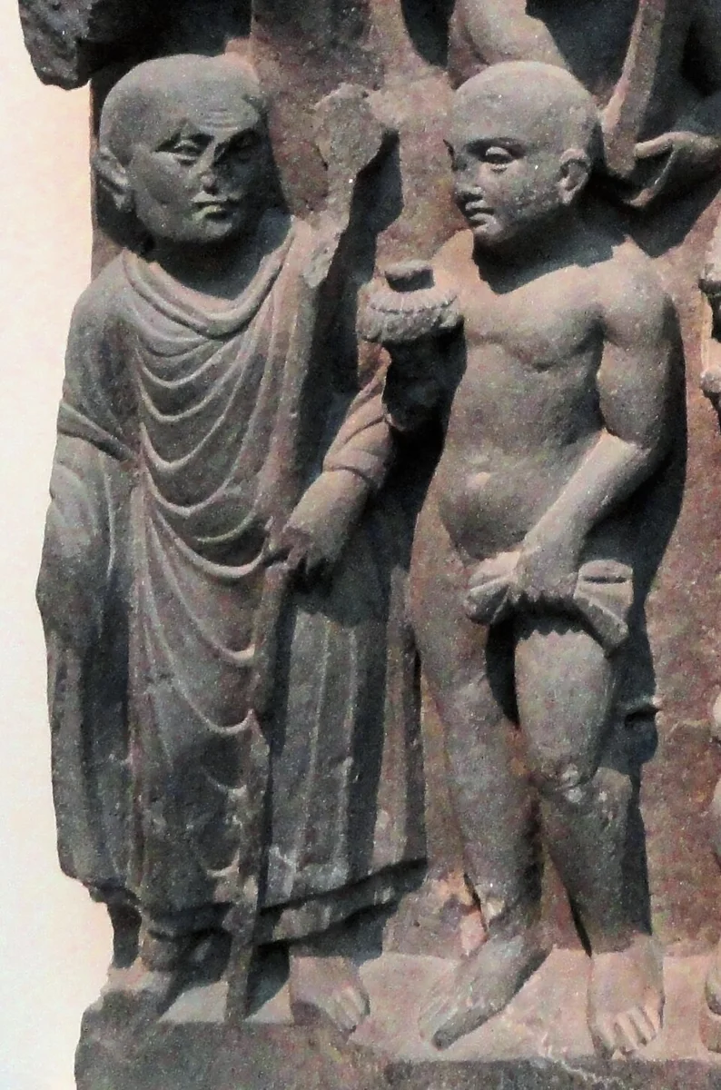 Gandhara sculpture identified as Mahākāśyapa meeting an Ājīvika and learning of the Buddha’s parinirvana.