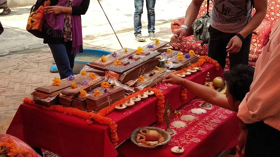 Navagrantha manuscript worship before recitation, illustrating the ritual reception of Mahayana scriptures.