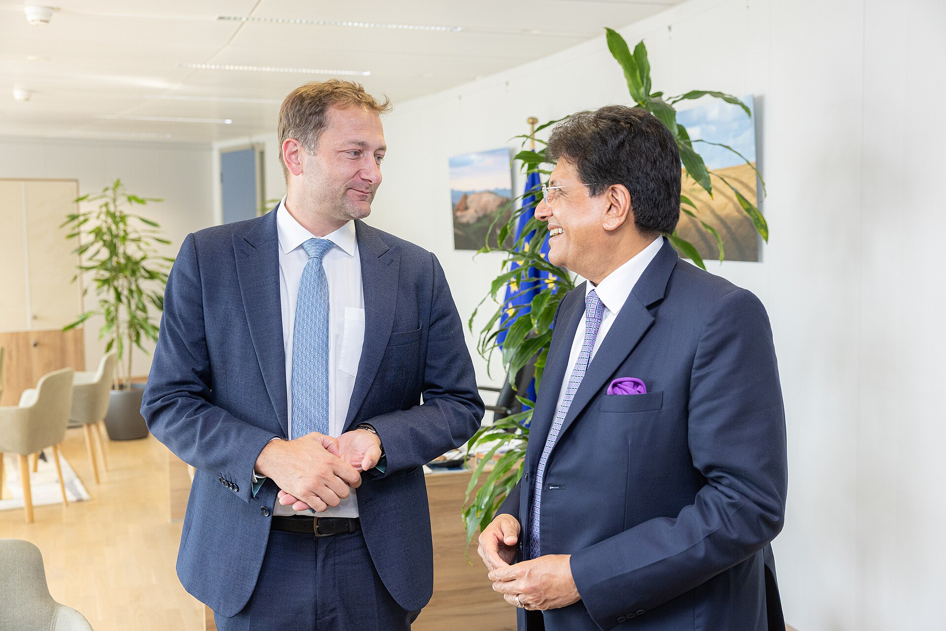 Reference view of Christophe Hansen (left) and Indian Commerce and Industry Minister Piyush Goyal during Goyal’s visit to the European Commission—not a photograph of the India–U.S. trade negotiations or an agreement signing.